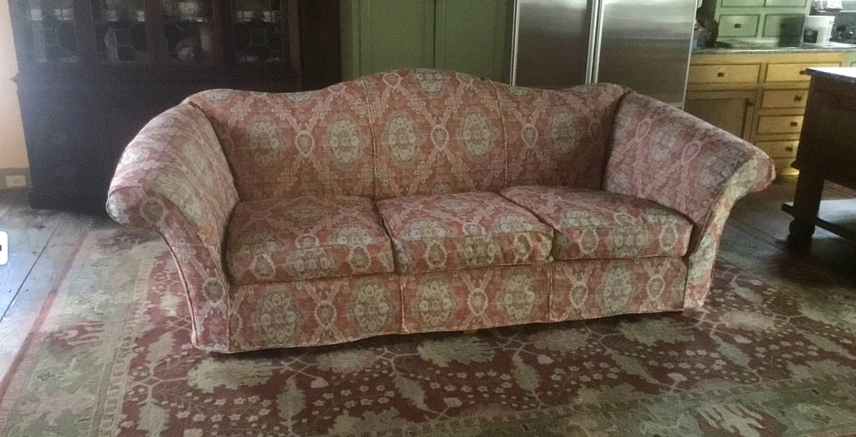 reupholstered sofa with rolled arms